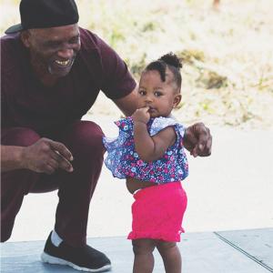 Smiling man with toddler